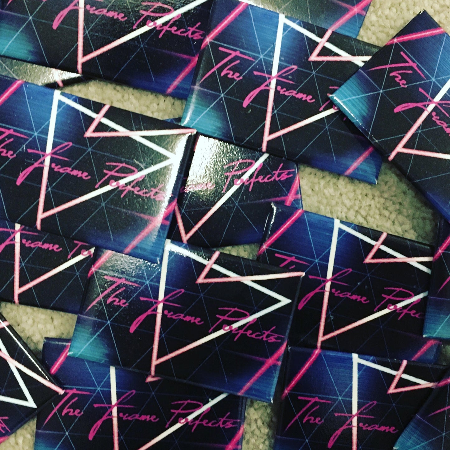 the frame perfects promotional button celebrating first synthwave live show